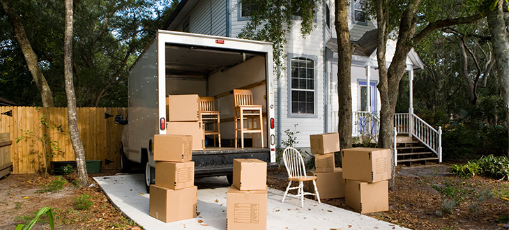 Household boxes and furniture ready for relocation