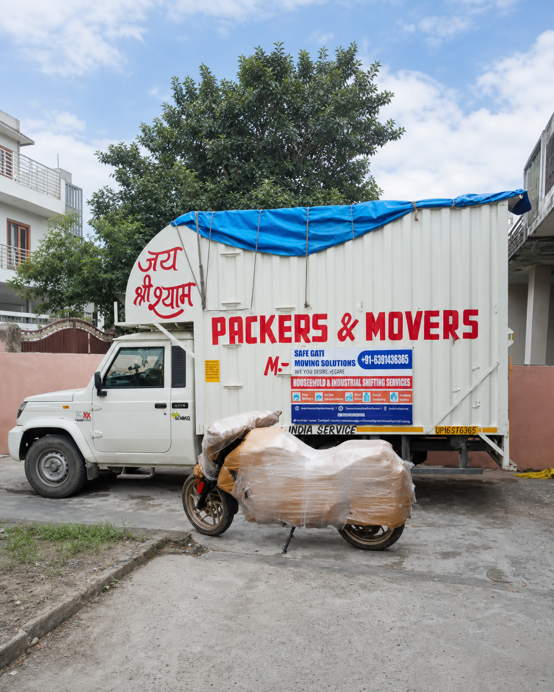 Safe Gati moving truck with a securely packed motorcycle ready for long-distance relocation